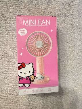 Hello Kitty mini fan rechargeable with pink Hello Kitty face on a pink ring